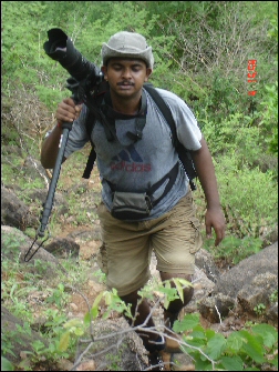 Arpit climbing with his camera