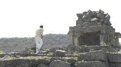 Mann at Puratan temple at Ghumli
